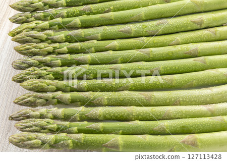 Fresh and delicious green asparagus 127113428