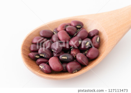 Close-up of black beans on a spoon 127113473