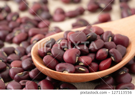 Close-up of black beans on a spoon Close-up of black beans on a spoon 127113556