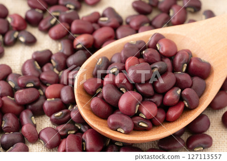 Close-up of black beans on a spoon 127113557