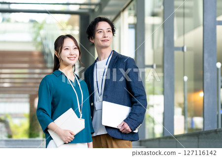 Male and female engineers working in an office. Filming cooperation: SKY Perfect Tokyo Media Center 127116142