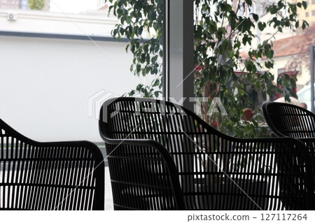 Black chair in studio for working space. 127117264