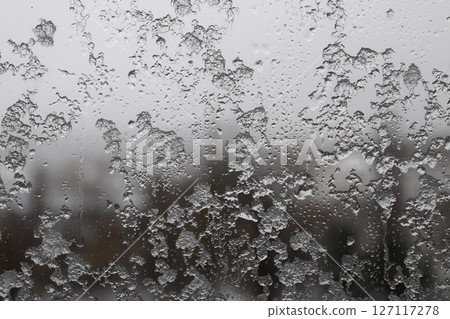 On a snow day, splashes on the window. 127117278