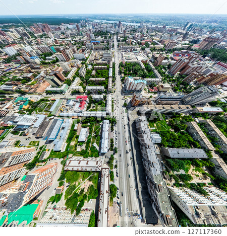 Aerial city view with crossroads and roads, houses, buildings, parks and parking lots. Sunny summer panoramic image Aerial city view with crossroads and roads, houses, buildings, parks and parking lots. Sunny summer panoramic image 127117360