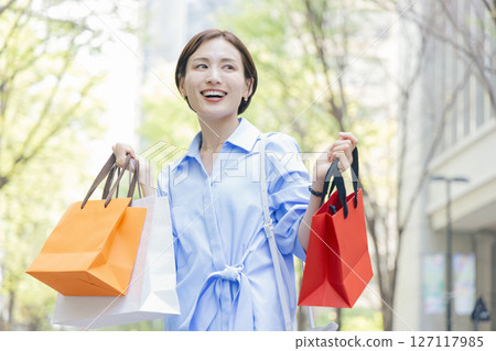 Shopping Woman holding a shopping bag Shopping Woman holding a shopping bag 127117985
