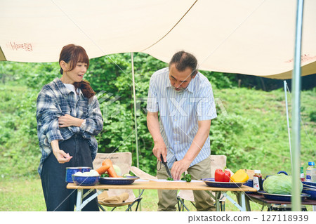 Senior couple camping outdoor barbecue BBQ family Senior couple camping outdoor barbecue BBQ family 127118939