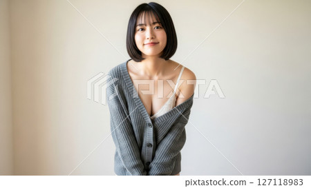 Lingerie fashion portrait of a smiling young female model 127118983