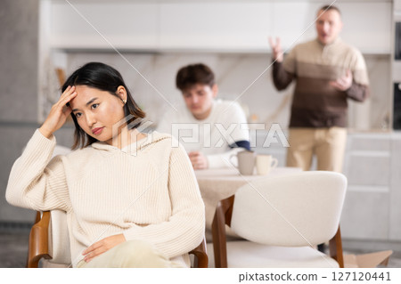 Adult and young man quarreling with woman 127120441