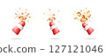 Santa Claus hand holding a festive popper confetti 127121046