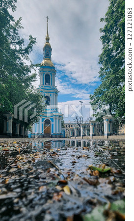 Panoramic view of St. Nicholas Naval Cathedral with high bell tower. Beautiful reflection in water. Nikolo-Bogoyavlenskiy Morskoy Sobor built in 1762 in Saint Petersburg, Russia Panoramic view of St. Nicholas Naval Cathedral with high bell tower. Beautiful reflection in water. Nikolo-Bogoyavlenskiy Morskoy Sobor built in 1762 in Saint Petersburg, Russia 127121063