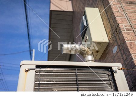 Steam coming out of the outdoor unit of a gas heat pump 127121249
