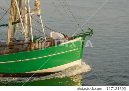 Close-up of the bow of a fishing trawler on the North Sea, Buesum, Schleswig-Holstein, Germany 127121893