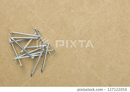 Nails placed on MDF board Nails placed on MDF board 127122058