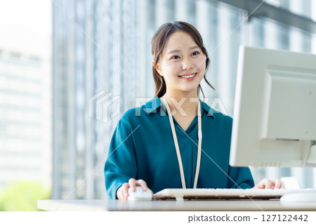 Young engineers working in an office. Photo courtesy of Sky Perfect Tokyo Media Center. 127122442