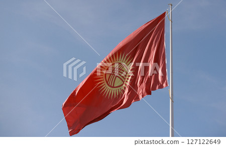 Kyrgyzstan flag is waving in Ala-Too Square 127122649