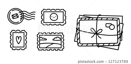 A stack of letters and postage stamps 127123789