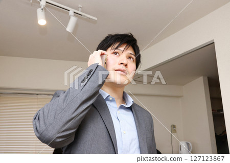 A man who makes a phone call 127123867