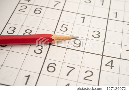 Sudoku puzzle game playing to challenge brain. 127124072