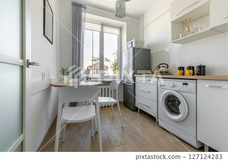 Full Modern Kitchen with Dining Area and Window Light Full Modern Kitchen with Dining Area and Window Light 127124283