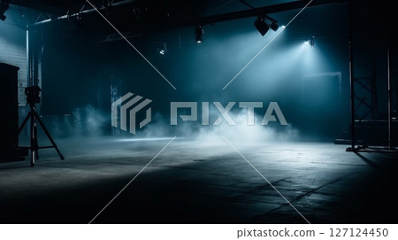 A stage enveloped in smoke and lights 127124450