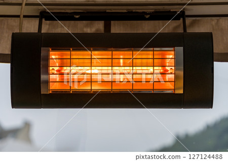 Electric infrared patio heater glowing on a terrace in Bergen, Norway 127124488
