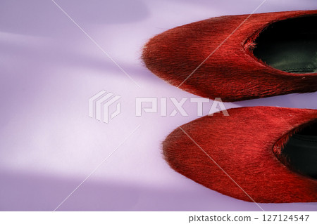 Burgundy textured leather pair with small heel, on purple background, copy space Burgundy textured leather pair with small heel, on purple background, copy space 127124547