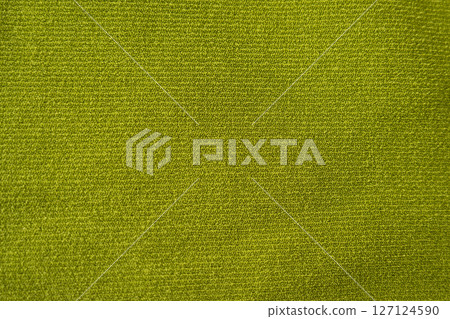 Moss green ribbed fabric close-up with soft texture 127124590