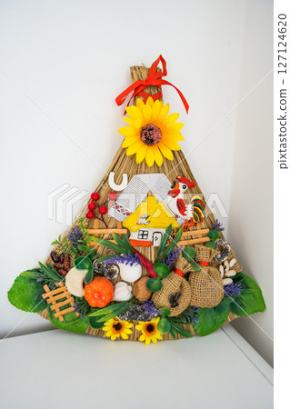 Traditional Ukrainian decorative broom with folk motifs and natural elements 127124620