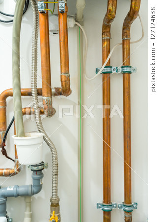 Copper pipes and plumbing system in a modern household Copper pipes and plumbing system in a modern household 127124638