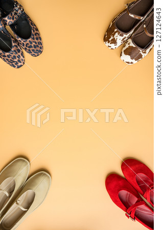 Assorted spring fashion ballet flats in vibrant and apricot tones with copy space. Assorted spring fashion ballet flats in vibrant and apricot tones with copy space. 127124643