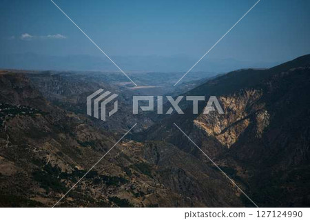 a view of the mountain road, city and mountains from the funicular near Tatev Monastery a view of the mountain road, city and mountains from the funicular near Tatev Monastery 127124990