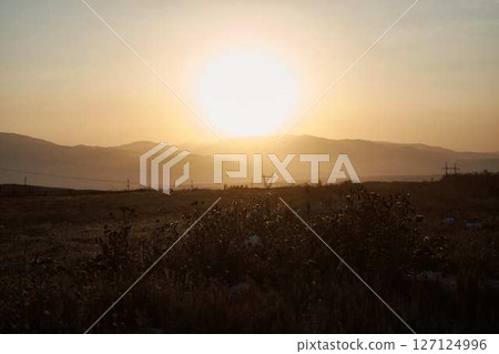 a sunset in the desert beyond the mountains, Armenia a sunset in the desert beyond the mountains, Armenia 127124996