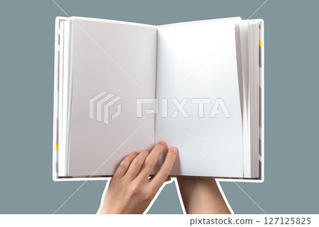 Hand holding an open book with blank pages, symbolizing the potential for learning, knowledge, and Hand holding an open book with blank pages, symbolizing the potential for learning, knowledge, and 127125825