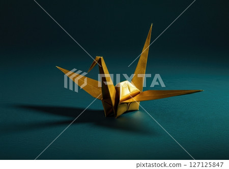 Elegant  origami paper crane with dramatic lighting on dark teal background showcasing traditional Japanese folding art and minimalist aesthetic design 127125847