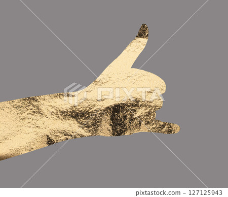 Gold metallic shaka hand gesture, symbolizing aloha, freedom, and a relaxed lifestyle. Stylish and Gold metallic shaka hand gesture, symbolizing aloha, freedom, and a relaxed lifestyle. Stylish and 127125943