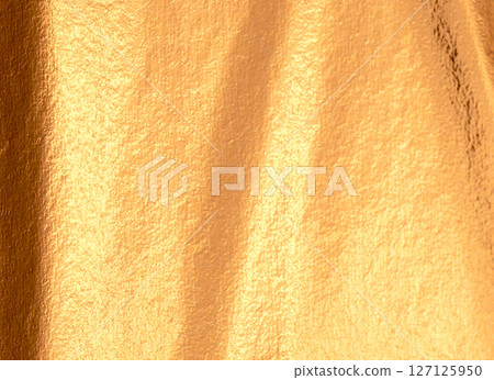 Golden and copper foil texture with a glossy, sleek finish, creating a premium, modern backdrop. Golden and copper foil texture with a glossy, sleek finish, creating a premium, modern backdrop. 127125950