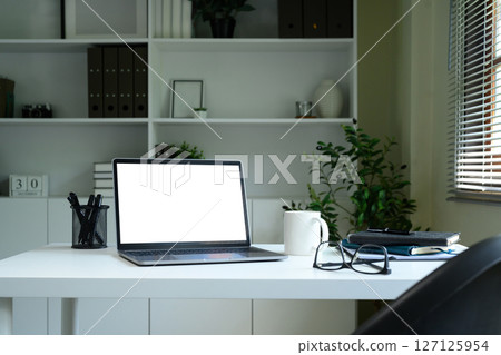 Laptop computer blank screen with clipping path on table. Workspace concept. Laptop computer blank screen with clipping path on table. Workspace concept. 127125954