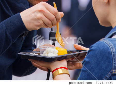 Close-Up of People Sharing a Meal Outdoors During a Social Gathering Close-Up of People Sharing a Meal Outdoors During a Social Gathering 127127730