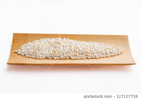 Sticky rice on a wooden plate Sticky rice on a wooden plate 127127738