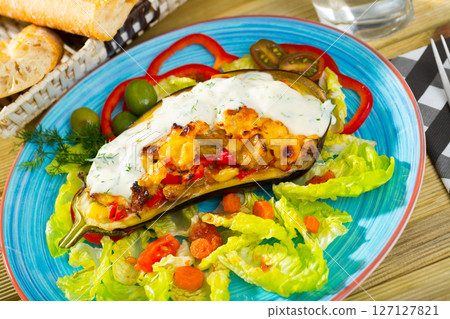 Stuffed eggplant with vegetables and cheese 127127821