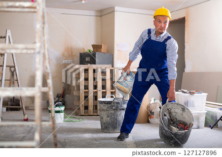 Man builder working in construction site Man builder working in construction site 127127896