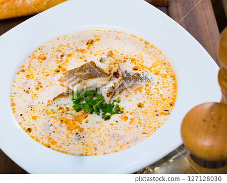 Norwegian cod soup with bread 127128030