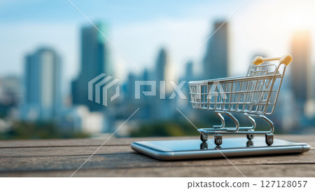 Digital shopping cart on smartphone screen, cityscape background, modern online shopping, urban technology concept 127128057
