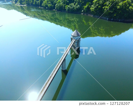 Aerial view of Uzura Dam in Atsutacho, Hokkaido in early summer 127128207