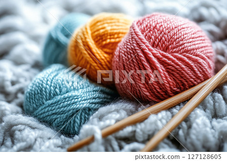 Ready to Create. Cream-colored yarns skeins and knitting needles on a white background. Ready to Create. Cream-colored yarns skeins and knitting needles on a white background. 127128605