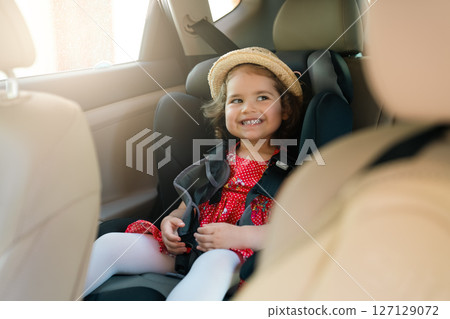 Cute little baby child sitting in car seat. Portrait of cute little baby child sitting in car seat.Safety concept. Cute little baby child sitting in car seat. Portrait of cute little baby child sitting in car seat.Safety concept. 127129072