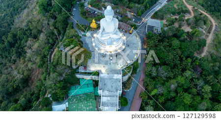 Aerial View drone shot of Big Buddha Statue on the high mountain at Phuket thailand in evening time. 127129598