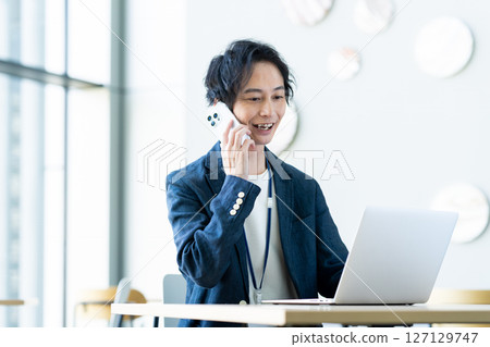 Engineers working in the office. Photo courtesy of Sky Perfect Tokyo Media Center. Engineers working in the office. Photo courtesy of Sky Perfect Tokyo Media Center. 127129747