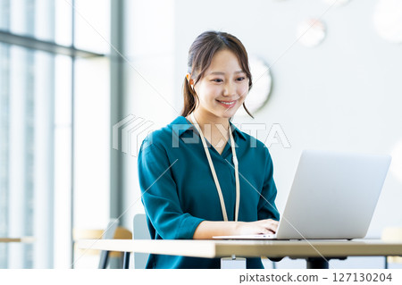 Young engineers working in an office. Photo courtesy of Sky Perfect Tokyo Media Center. 127130204
