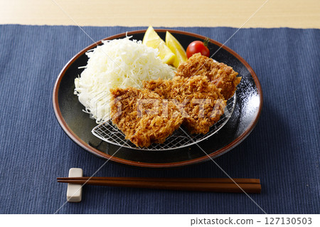 Delicious pork fillet cutlet served on a plate Delicious pork fillet cutlet served on a plate 127130503